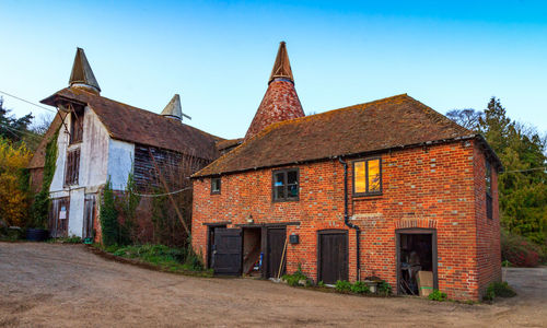 Exterior of old building against clear blue sky