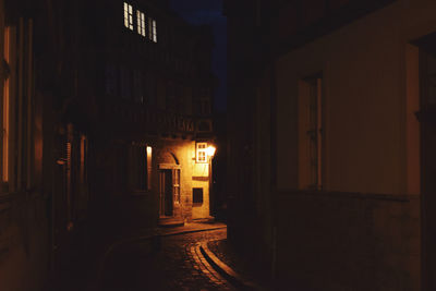 Illuminated building in city at night