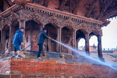 People at historical building