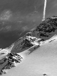 Scenic view of snow covered mountains against sky