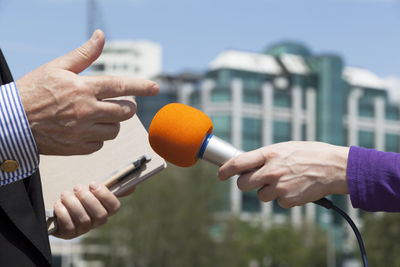 Close-up of hand holding city