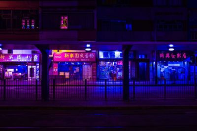 Illuminated city street at night