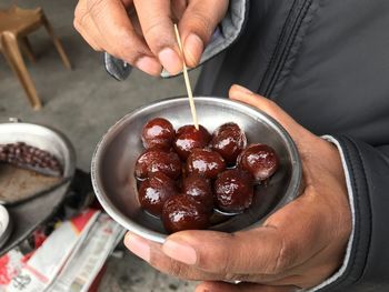 Midsection of man preparing food