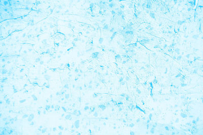 Full frame shot of ice on blue surface
