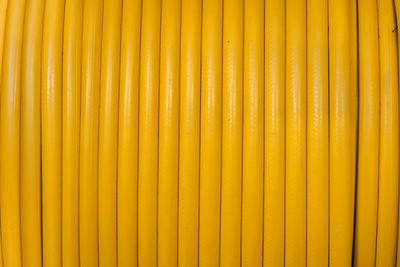 Full frame shot of yellow rubber hose