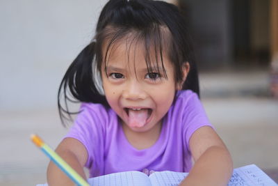 Portrait of cute girl with book