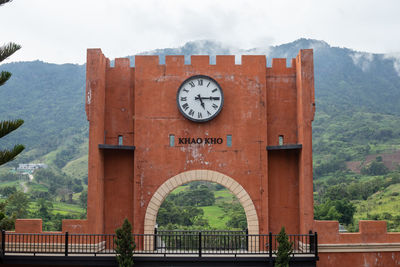 Close-up of clock tower against building