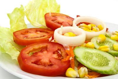 Close-up of fruits and vegetables in plate