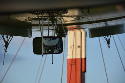 Close-up of blimp flying against blue sky