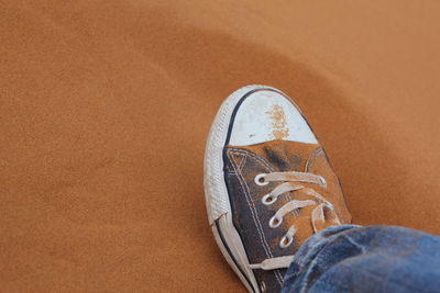 Low section of woman standing on tiled floor