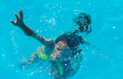 Woman swimming in pool