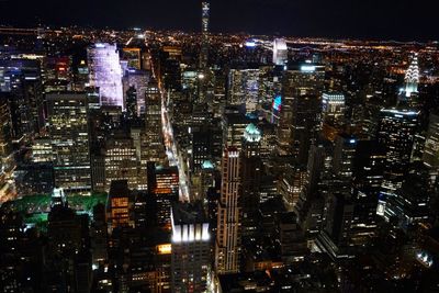 High angle view of illuminated cityscape at night