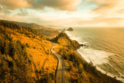 High angle view of road by sea against sky