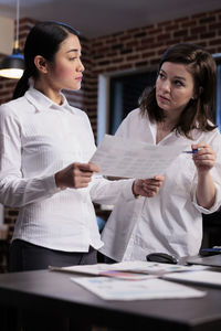 Female colleagues working at office