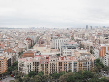 High angle view of buildings in city against sky