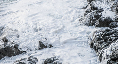 High angle view of flowing water in winter