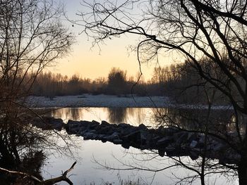 Scenic view of frozen lake against sky during winter