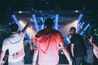 Rear view of people enjoying music concert