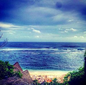 Scenic view of sea against cloudy sky