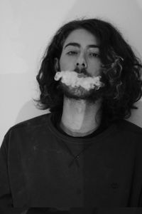 Portrait of young man smoking