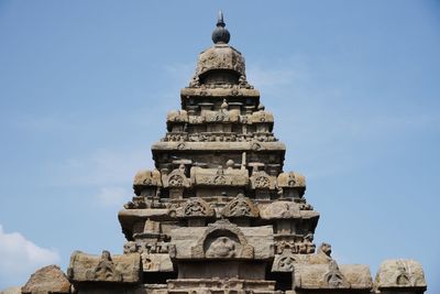 Low angle view of temple against clear blue sky