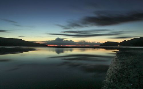 Scenic view of lake at sunset