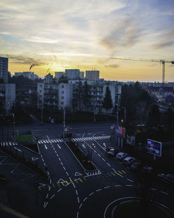 High angle view of city street and buildings against sky