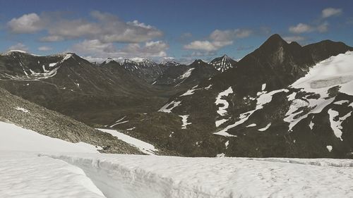Scenic view of mountains against sky during winter