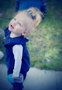 High angle view of cute girl on street