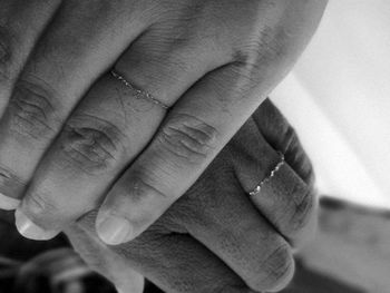 Close-up of couple holding hands