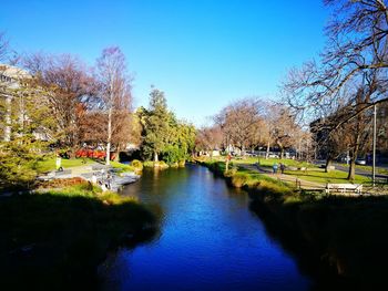 Scenic view of river against blue sky