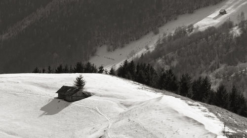 Scenic view of snow covered field against mountain