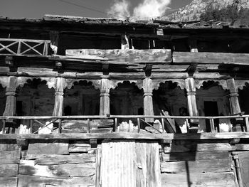 Low angle view of abandoned building against sky