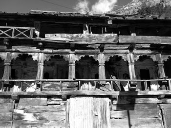 Low angle view of abandoned building against sky