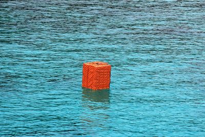 Red umbrella on swimming pool