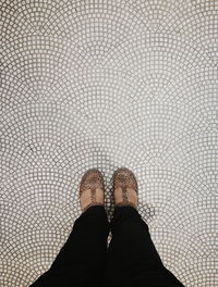 Low section of woman standing on floor