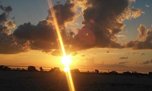 Scenic view of beach against sky during sunset