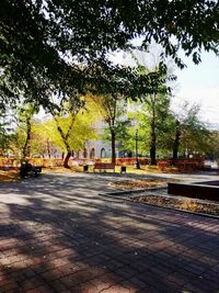 Street in park by city against sky