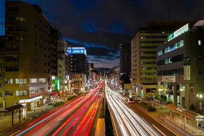 Illuminated city road at night