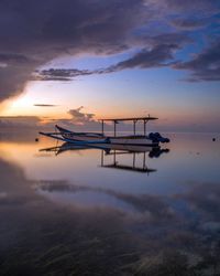 Scenic view of sea against sky at sunset