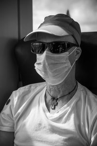 Portrait of man wearing sun glasses and face mask 