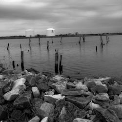 Scenic view of sea against cloudy sky