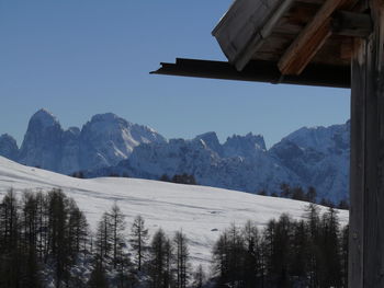 Scenic view of snowcapped mountains against clear sky