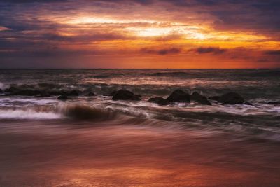 Scenic view of sea against sky during sunset