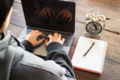 High angle view of person working on table