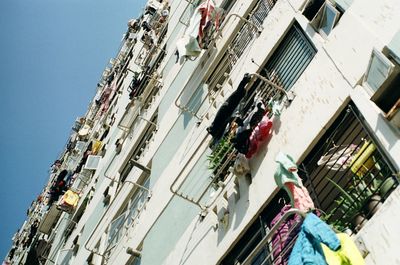 Low angle view of buildings in city against sky