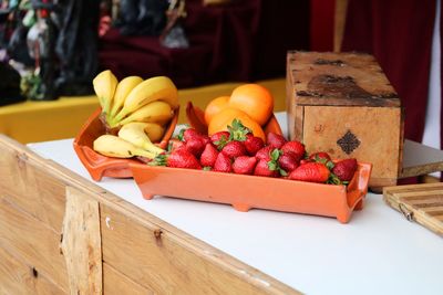 Various fruits in box on table