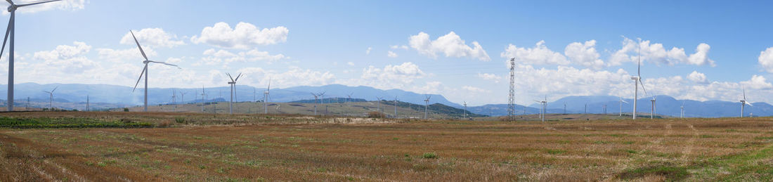 Panoramic view of field against sky