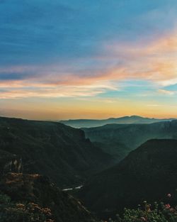 Scenic view of landscape against sky during sunset