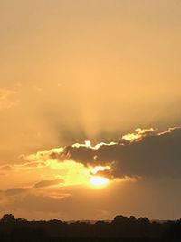 Low angle view of dramatic sky during sunset